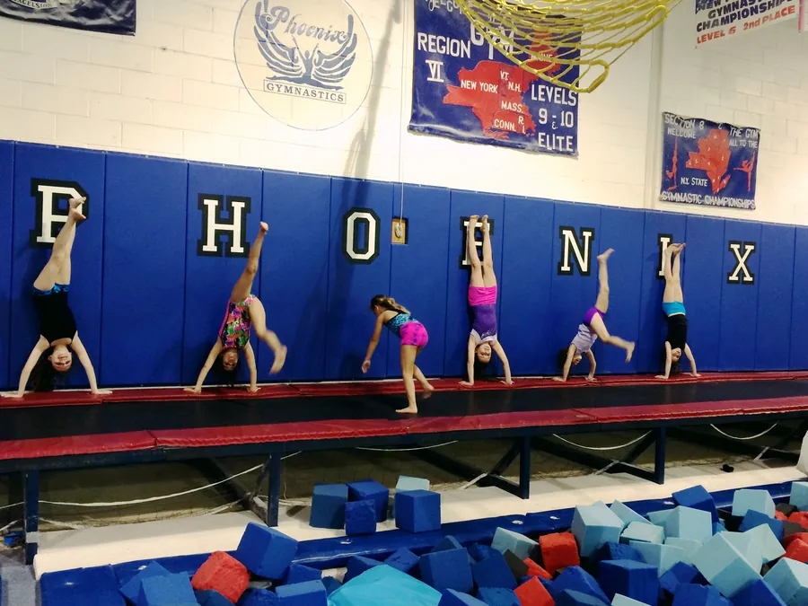 Handstand line-up across the floor at Phoenix Gymnastics