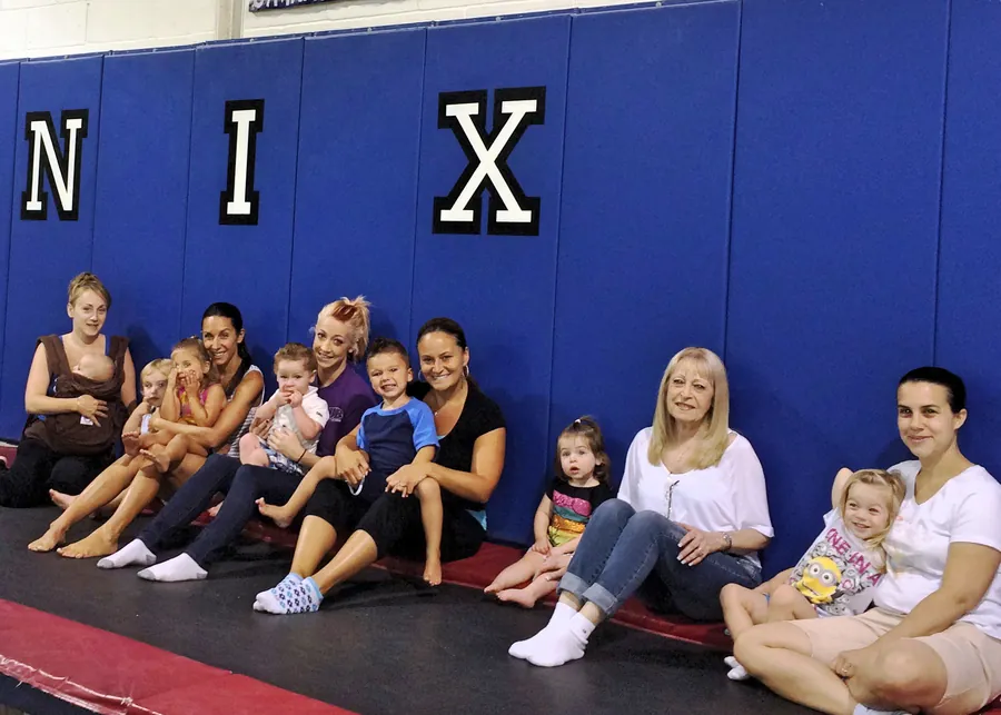 Parents and toddlers at a Mommy & Me class